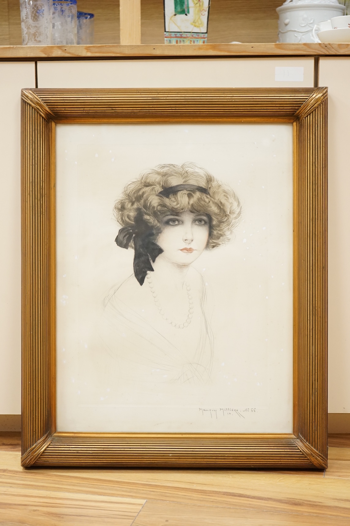 Maurice Milliere (French, 1859-1927), Portrait of a lady, signed and numbered 66 to margin, etching, 55 x 42cm, housed in a gilt frame